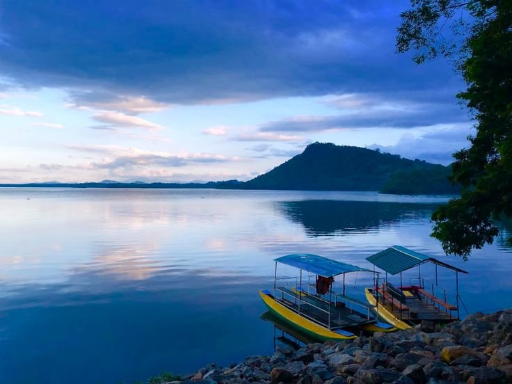Serene misty morning lake scene in rural Sri Lanka