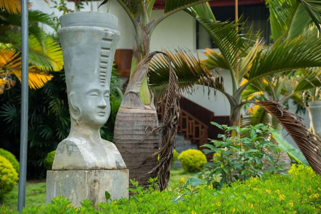 Charming tropical hotel exterior with colorful flowers