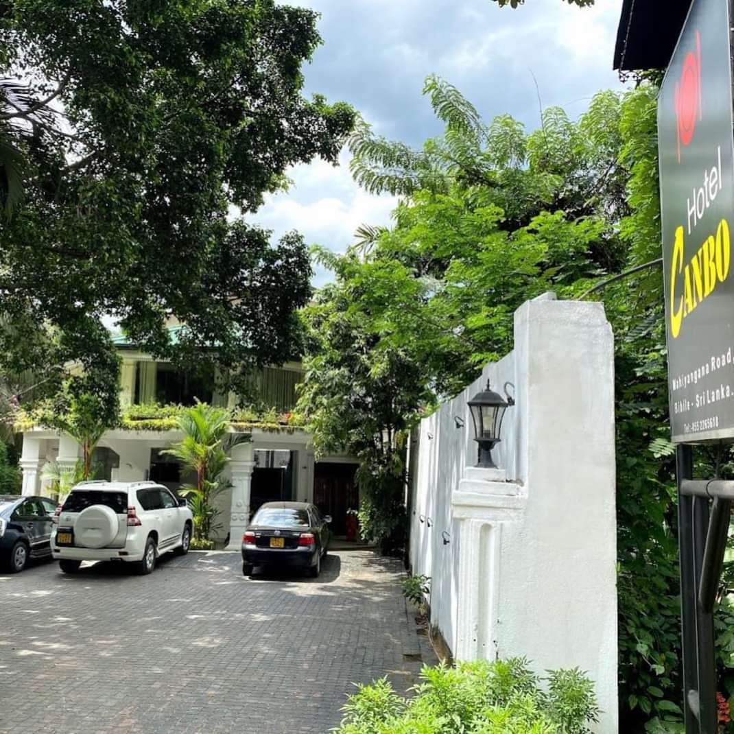 Hotel Canbo tropical resort exterior with lush gardens and golden sunlight